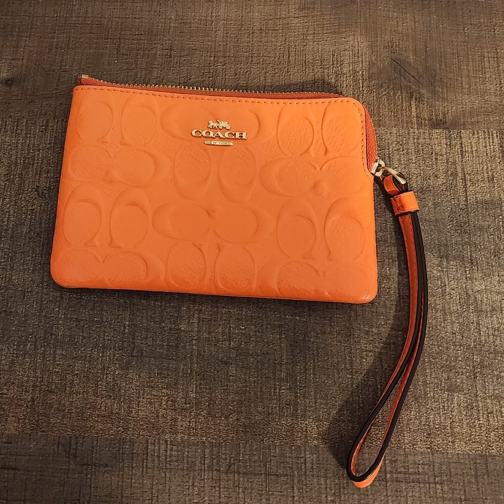 Coach bright orange wristlet